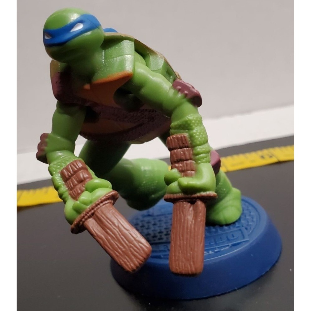 Teenage Mutant Ninja Turtles Leonardo Action Figure On Blue Stand
